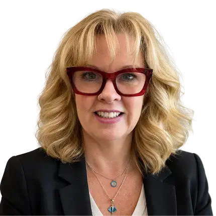 A woman wearing glasses and a black blazer, smiling confidently at the camera.