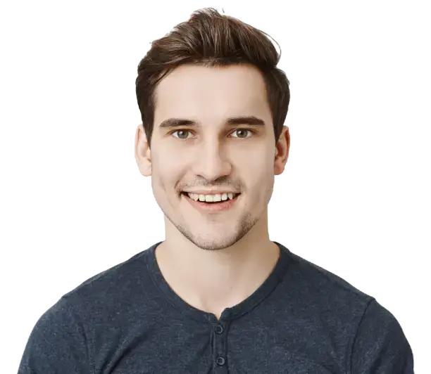 A man smiling warmly with his hands placed gently on his chest, exuding a sense of joy and contentment.